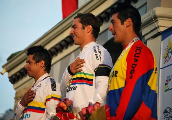 The elite men with hands to hearts for the national anthem.