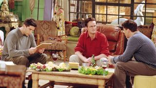 David Schwimmer as Ross Geller, Matthew Perry as Chandler Bing and Matt LeBlanc as Joey Tribbiani sitting in the living room in Friends