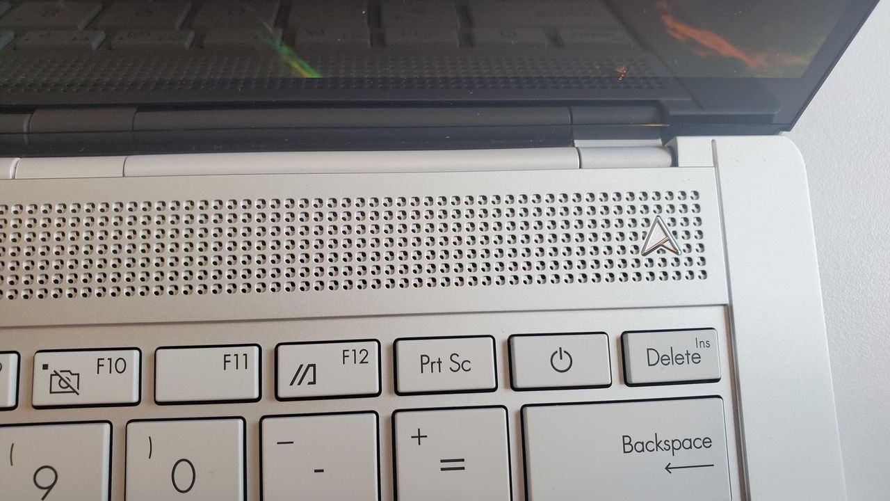 light silver laptop on table