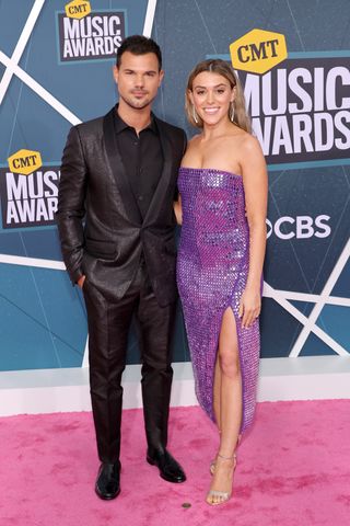 Taylor Lautner and Taylor Dome attend the 2022 CMT Music Awards at Nashville Municipal Auditorium on April 11, 2022 in Nashville, Tennessee