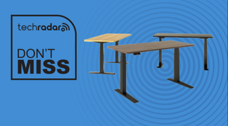 Three FlexiSpot standing desks on a blue background next to a TechRadar badge reading 'Don't Miss'