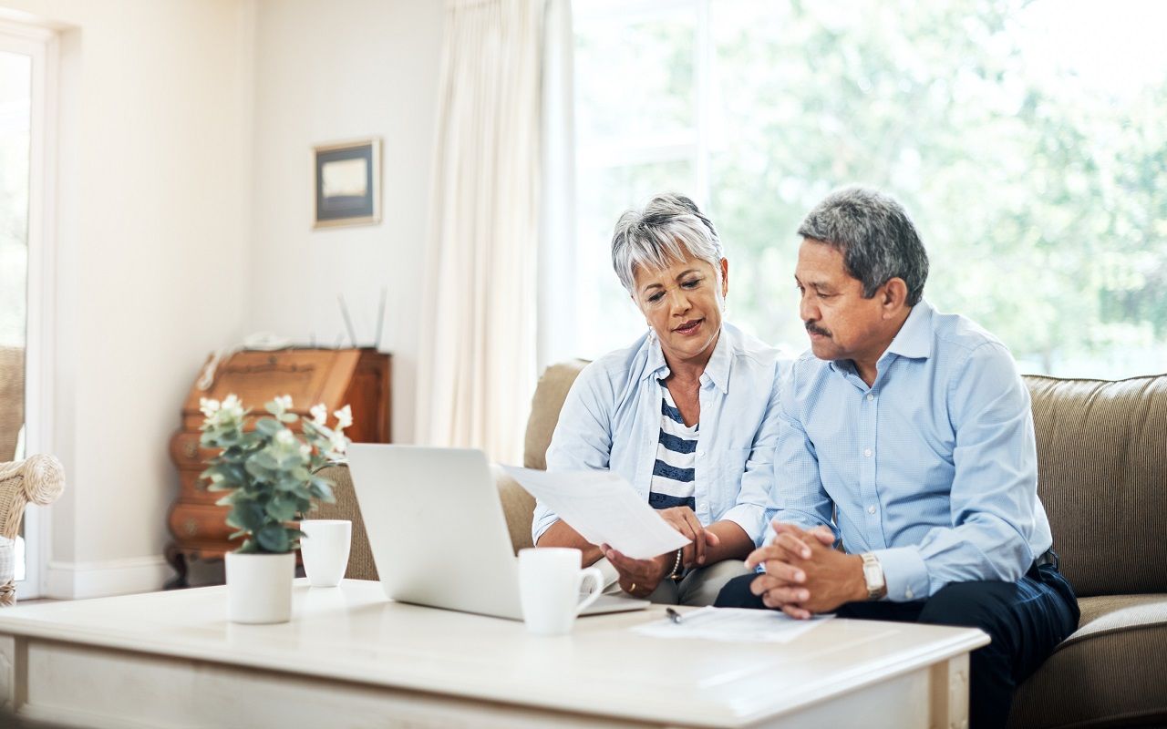 Shot of a senior couple using a laptop together at home