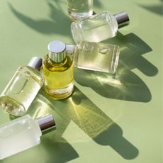 Perfume bottles on a green background