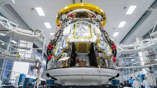 SpaceX's Crew-1 Crew Dragon space capsule is seen nearly complete at the company's Hawthorne, California facility.