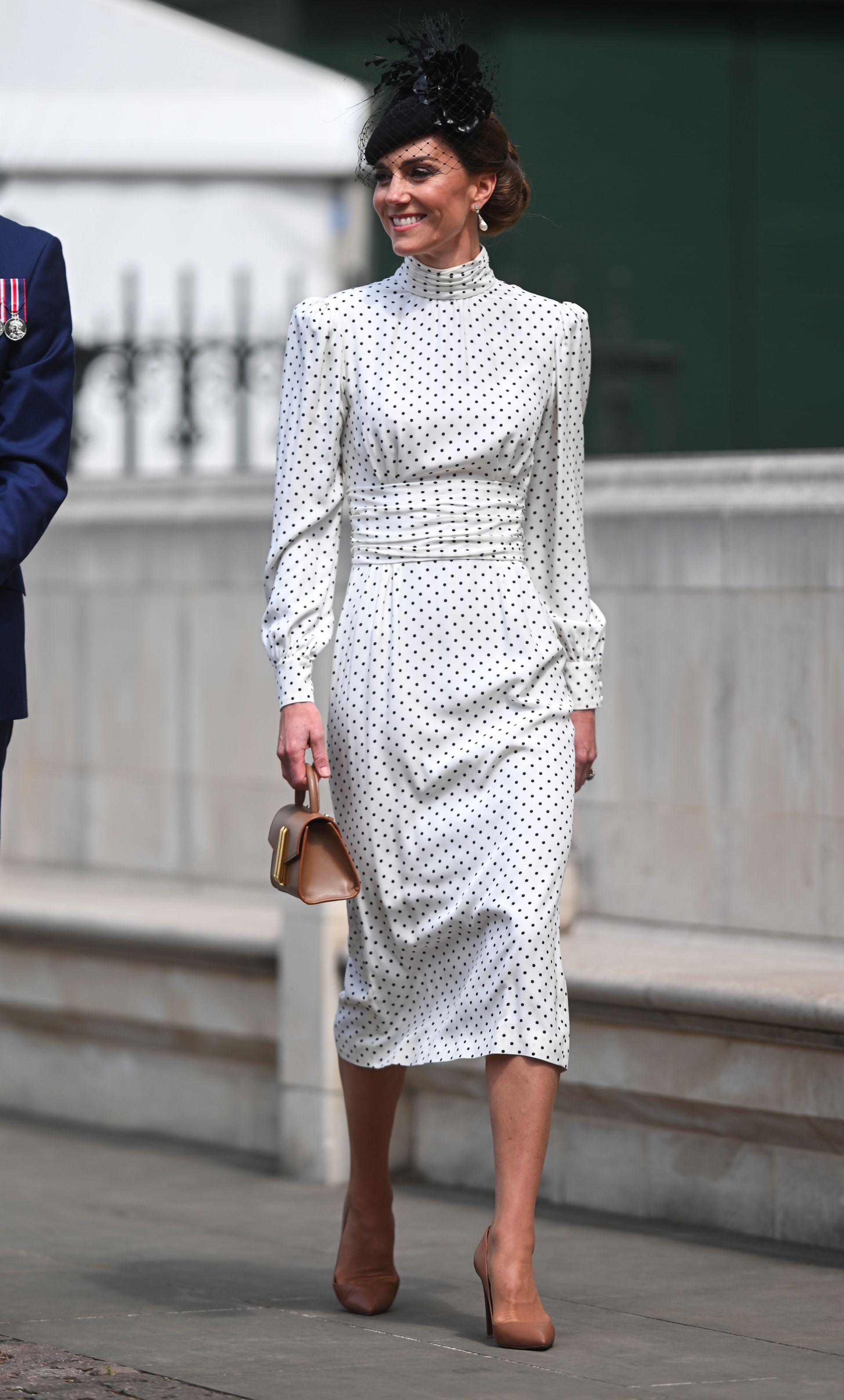 Kate Middleton and Princess Diana wear white polka dot dresses.