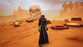 standing in desert in front of skull in desert