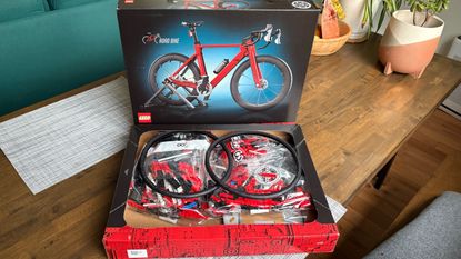 Inside the LEGO bike box, with all its parts in their packets, ready to be assembled