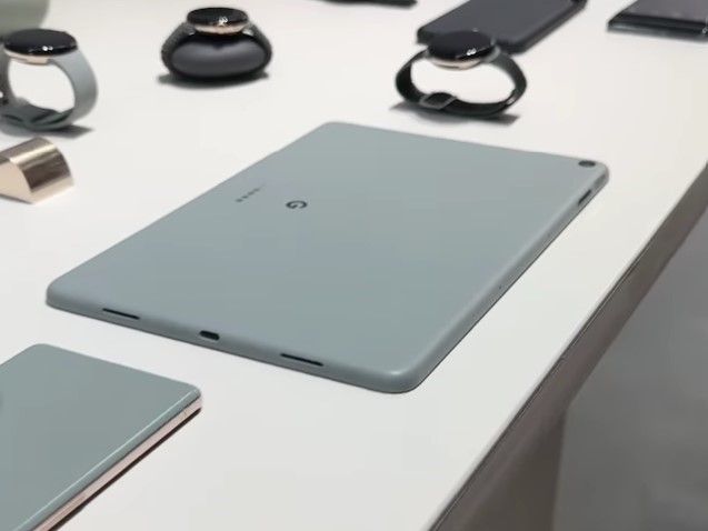 Pixel Tablet laid on a table along with other Google devices