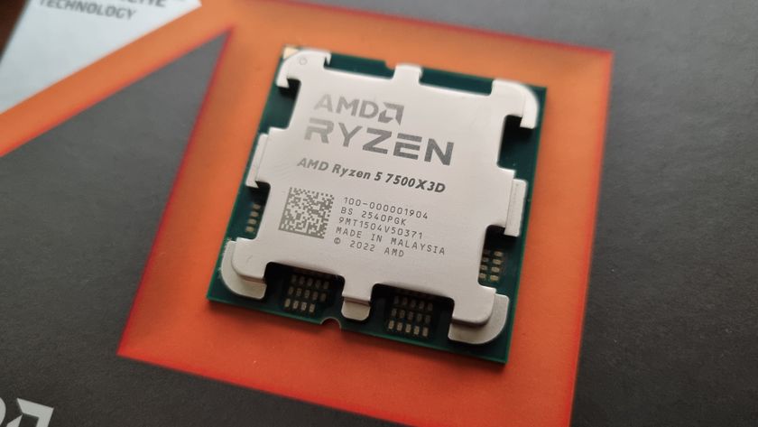 The AMD Ryzen 5 7500X3D on top of its packaging, with an orange background