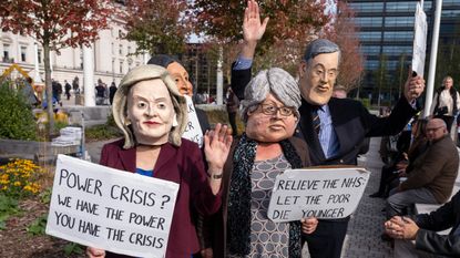 Protesters dressed as Liz Truss, Suella Braverman, Thérèse Coffey and Jacob Rees-Mogg outside Tory conference