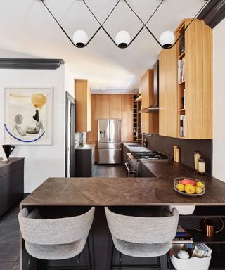 a galley kitchen with an L-shaped kitchen island