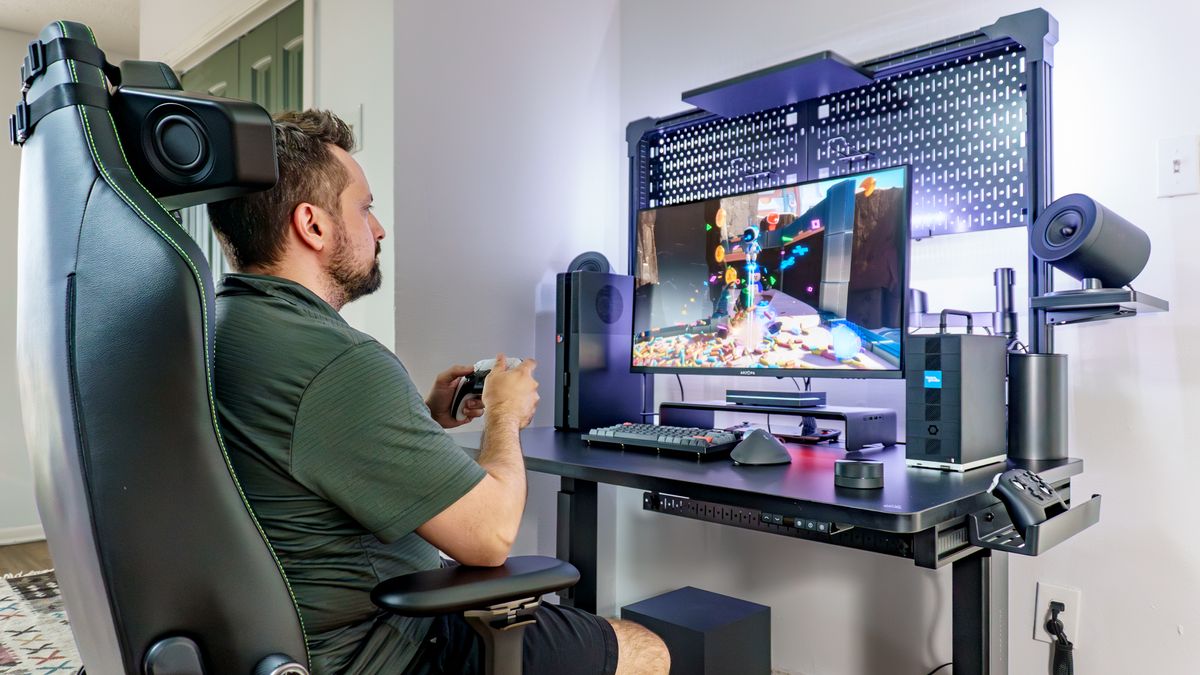 A person playing AstroBot on a PS5 Pro outfitted with BoxPlates console covers