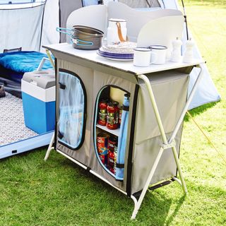 camping kitchen cupboard with tent