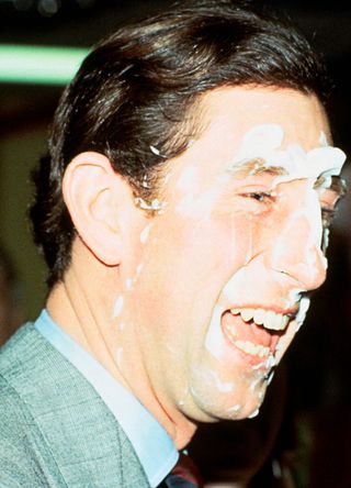 Prince Charles Agrees To The Custard Pie Treatment With A Plate Of Crazy Foam During A Visit To A Community Centre In Manchester