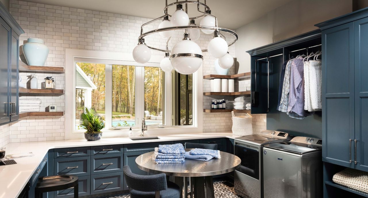 laundry room cabinet ideas in a large blue laundry room