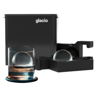 A whiskey ice ball maker with its black packaging