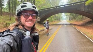 Moondog Roop and Justin Bright skateboarding along the Natchez Trace Parkway 