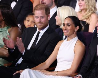 Meghan Markle and Prince Harry sitting in the audience at the ESPYs Awards