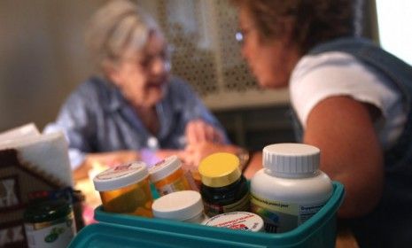 A registered nurse makes a house call for a 96-year-old Colorado woman on March 26