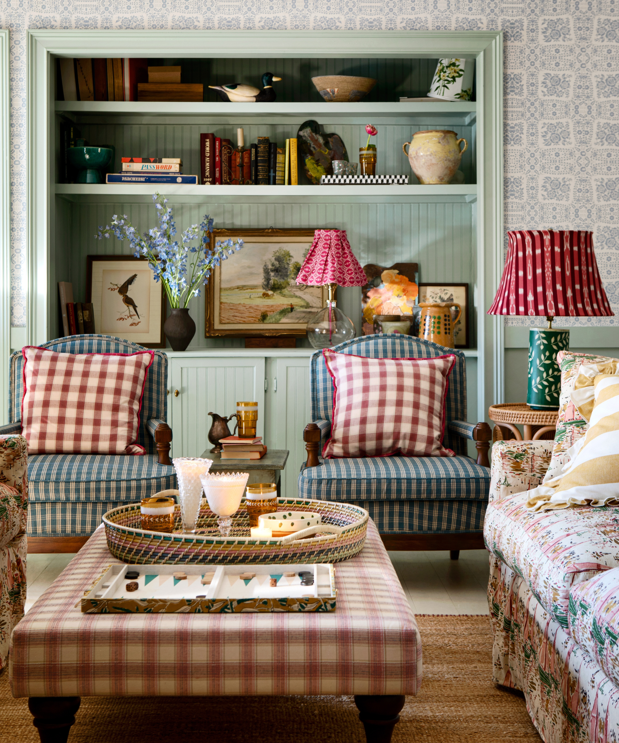 a characterful living room with patterns mixing, a built-in shelving unit with decor, and lots of color