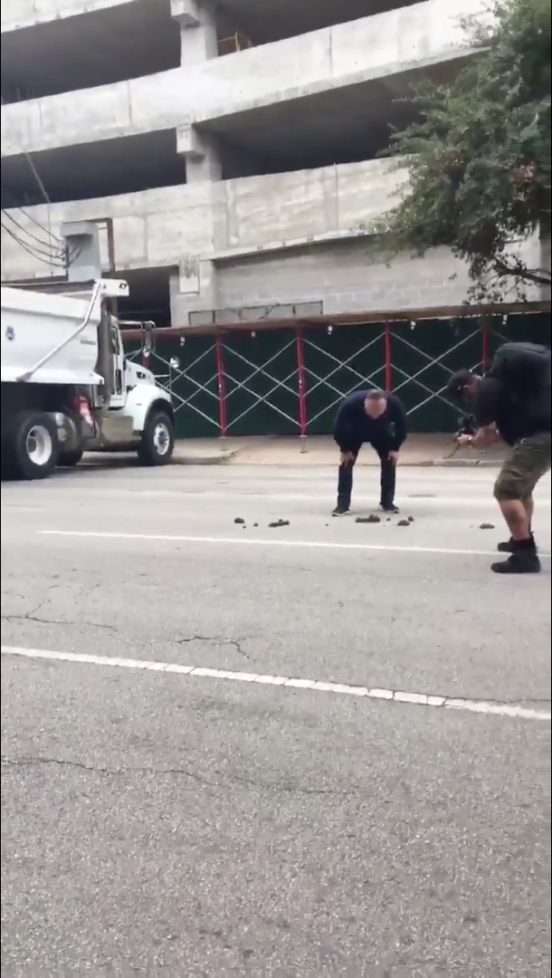 Alex Jones screaming at a pile of horse poop.