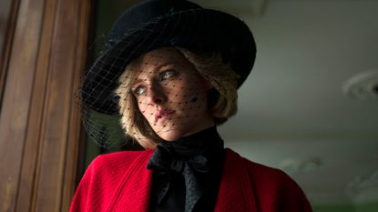 kristen stewart as princess diana wearing a black hat and red jacket in the movie spencer