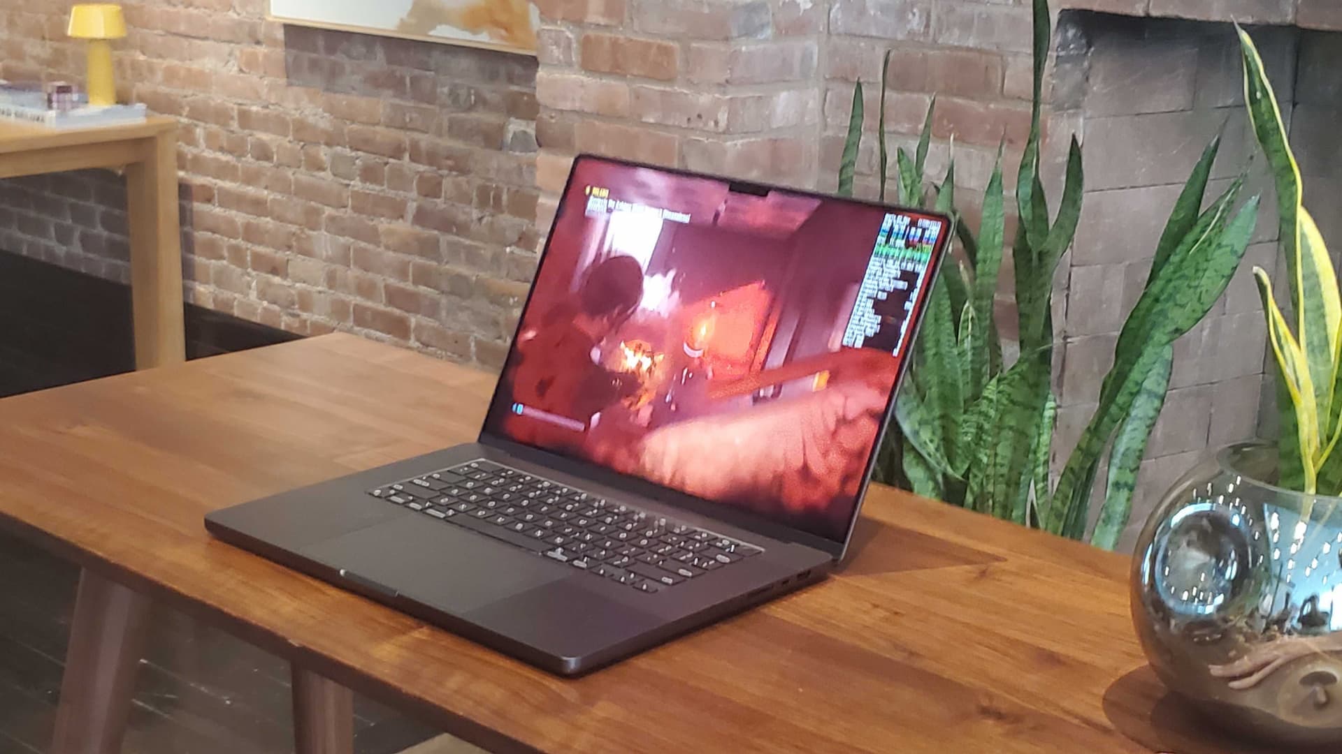 macbook on wooden desk