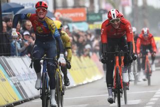 Lidl-Trek's Danish rider Mads Pedersen (L) celebrates next to Ineos Grenadiers' British rider Joshua Tarling as he crosses the finish line to win the 6th stage of the Paris-Nice cycling race, 209,8 km between Saint-Julien-en-Saint-Alban and Berre lâ€™Ã‰tang, on March 14, 2025. (Photo by Anne-Christine POUJOULAT / AFP)