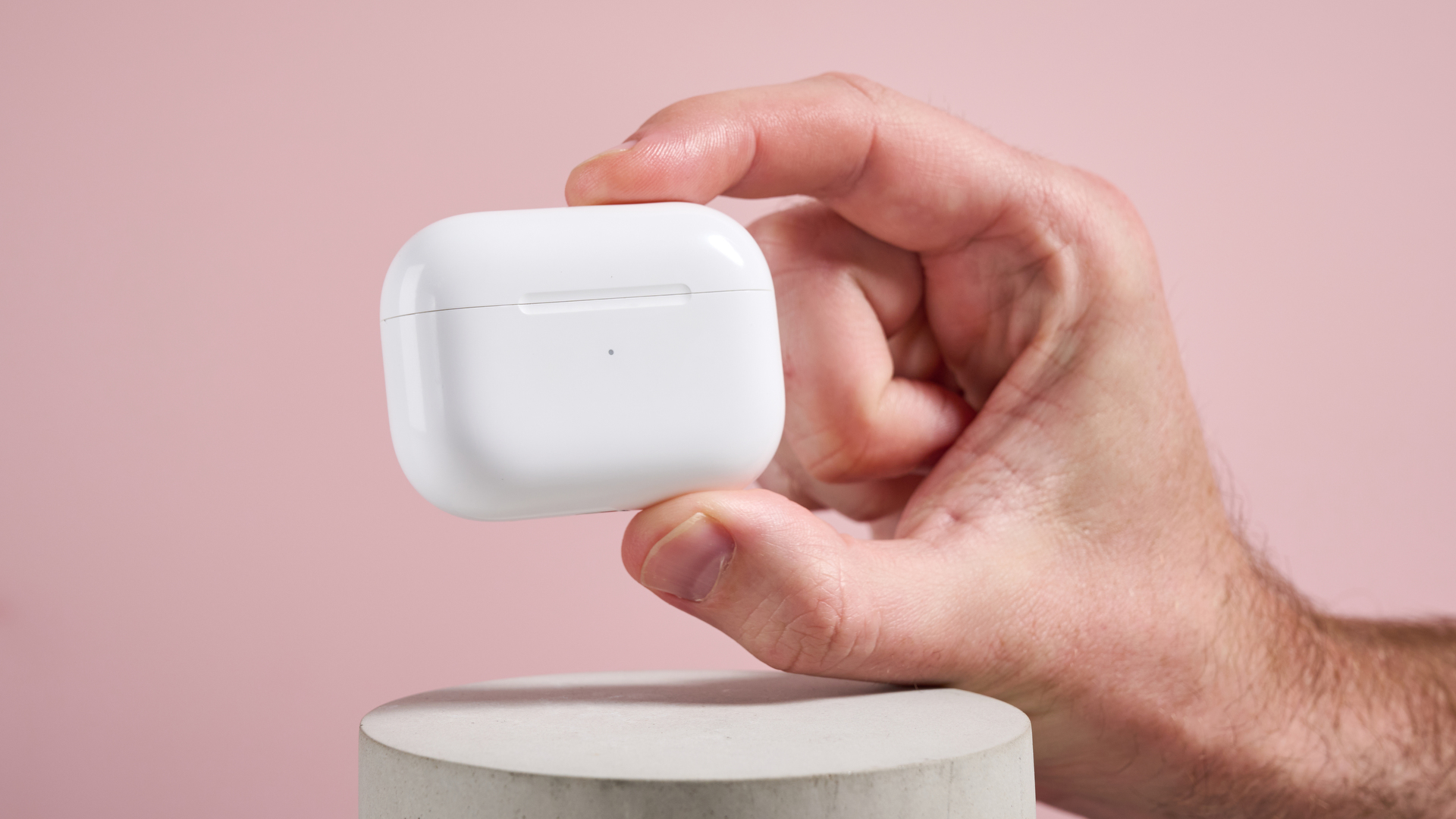 The AirPods Pro 2 case held in a hand