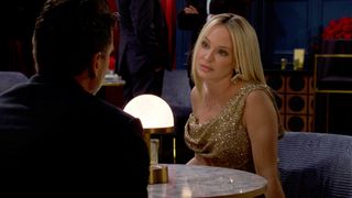 Joshua Morrow and Sharon Case as Nick and Sharon talking at a dinner table in The Young and the Restless