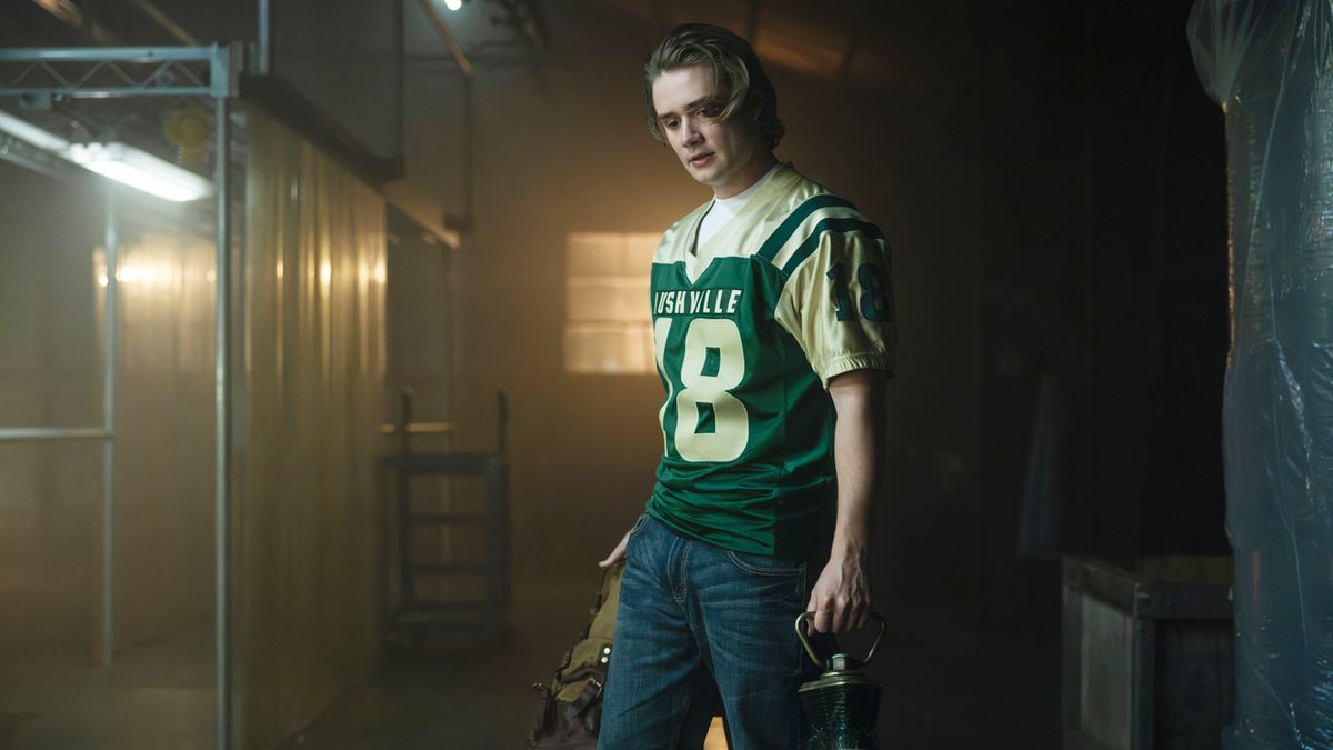 Noah Macon standing with a backpack and Lantern Battery in Lanterns episode 8