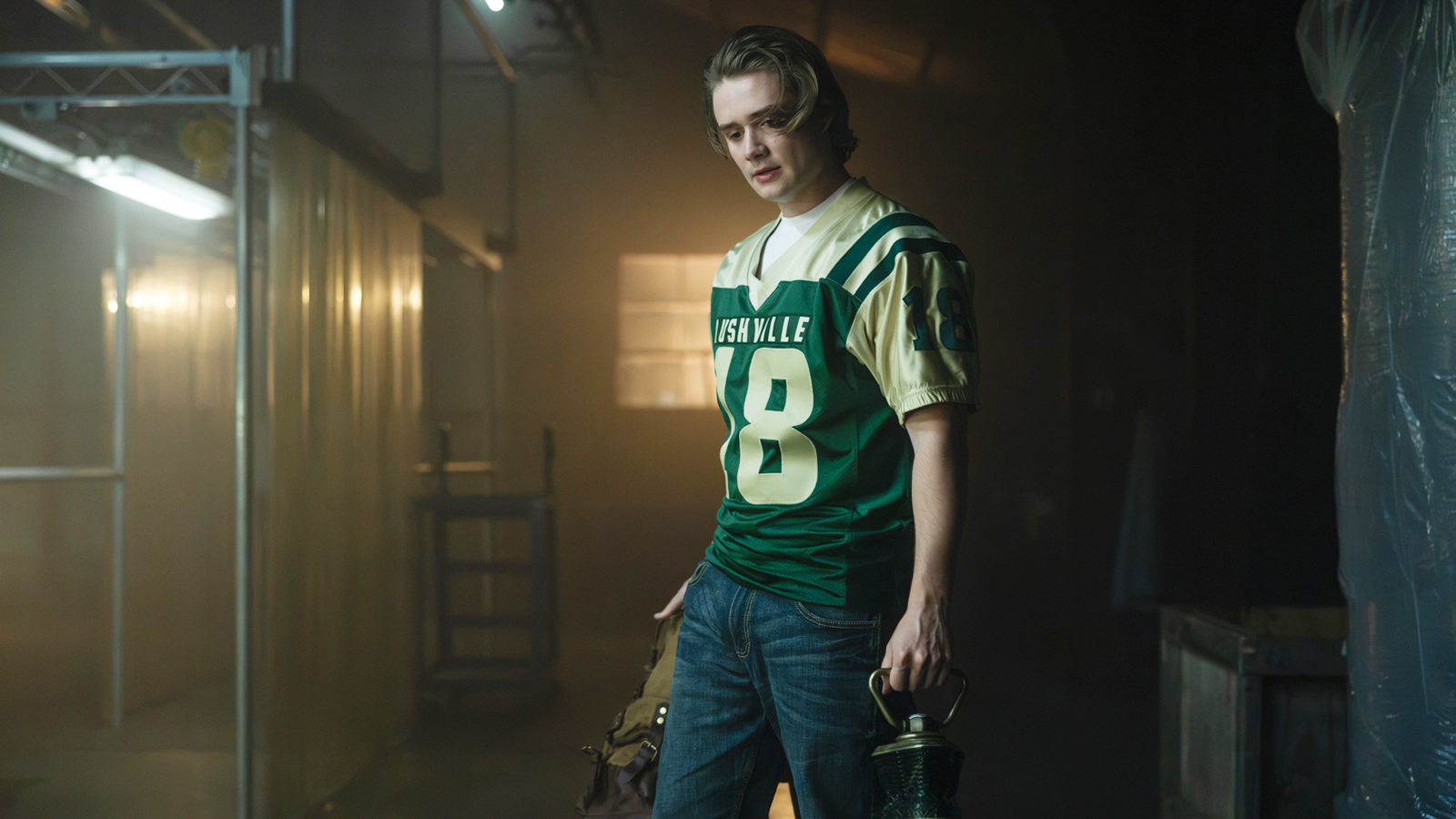 Noah Macon standing with a backpack and Lantern Battery in Lanterns episode 8