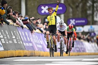 Dutch Marianne Vos of Team Visma-Lease a Bike celebrates as she crosses the finish to win the women's one-day cycling race Omloop Het Nieuwsblad 