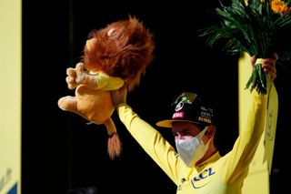 Team Jumbo rider Slovenias Primoz Roglic celebrates his overall leader yellow jersey on the podium at the end of the 12th stage of the 107th edition of the Tour de France cycling race 218 km between Chauvigny and Sarran on September 10 2020 Photo by STEPHANE MAHE POOL AFP Photo by STEPHANE MAHEPOOLAFP via Getty Images