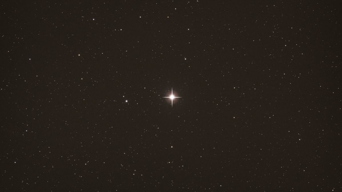 A bright star in the center of the screen against the dark background of space.