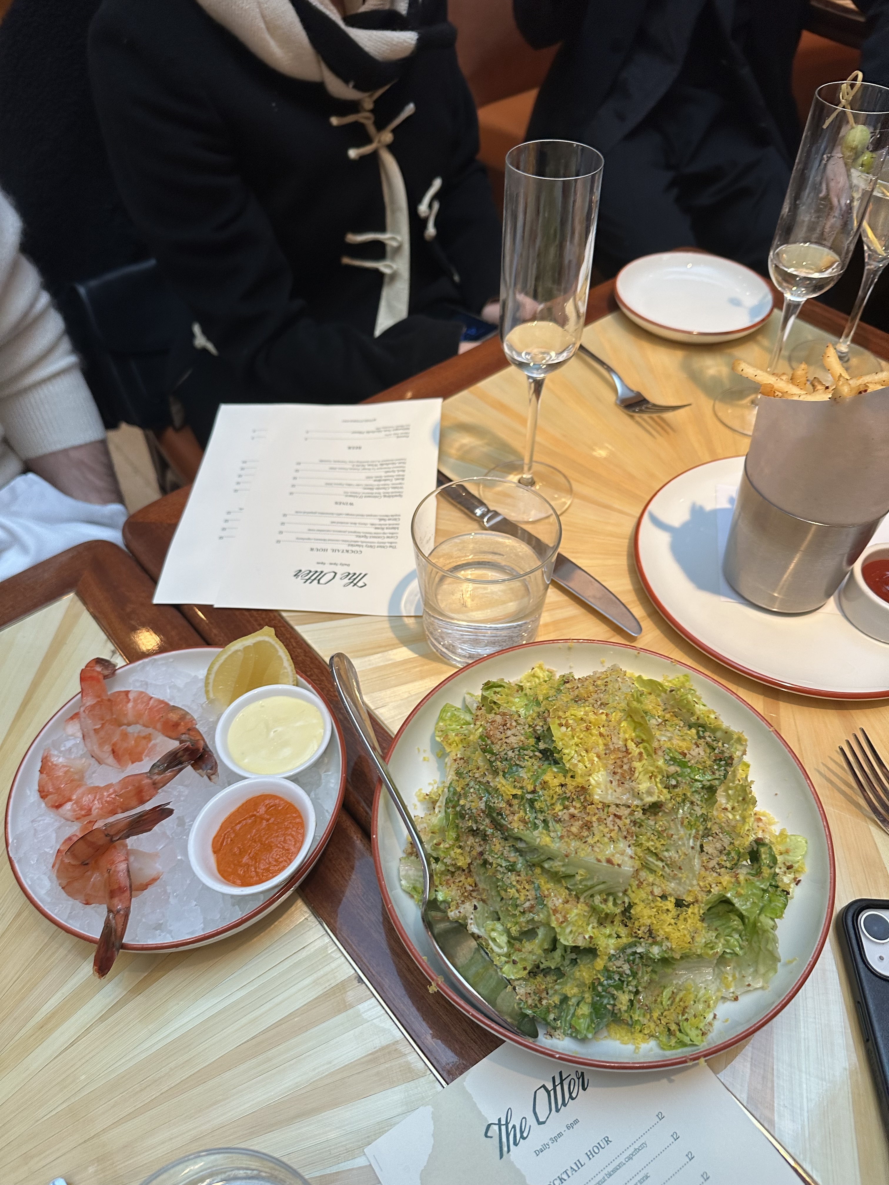 a photo of a salad and shrimp on a table at The Otter in SoHo