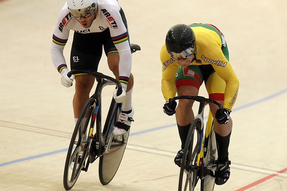 Lithuanian cyclist Vasilijus Lendel (R) competes with Russian Denis Dmitriev in the final men's Sprint race, during the Tissot UCI Track Cycling World Cup