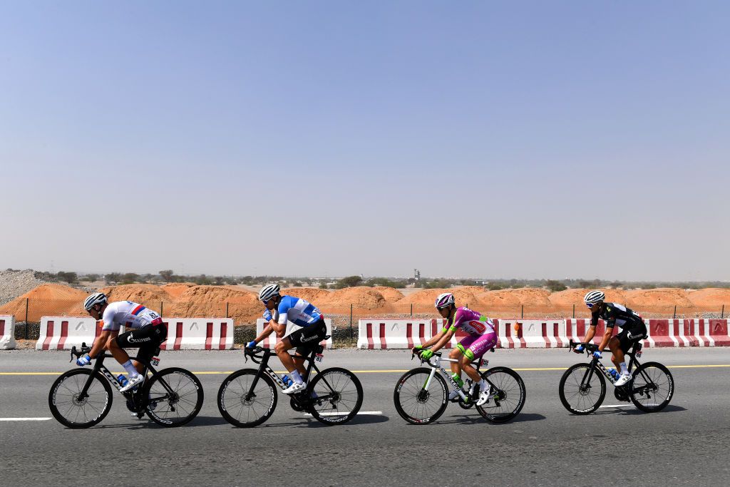AL MARJAN UNITED ARAB EMIRATES FEBRUARY 24 LR Michael Kukrle of Czech Republic Pavel Kochetkov of Russia and Team Gazprom Rusvelo Alessandro Tonelli of Italy and Team Bardiani Csf Faizane and Dmitrii Strakhov of Russia and Team Gazprom Rusvelo most aggressive jersey compete in the breakaway during the 4th UAE Tour 2022 Stage 5 a 182km stage from Ras al Khaimah Corniche to Al Marjan Island UAETour WorldTour on February 24 2022 in Al Marjan United Arab Emirates Photo by Tim de WaeleGetty Images