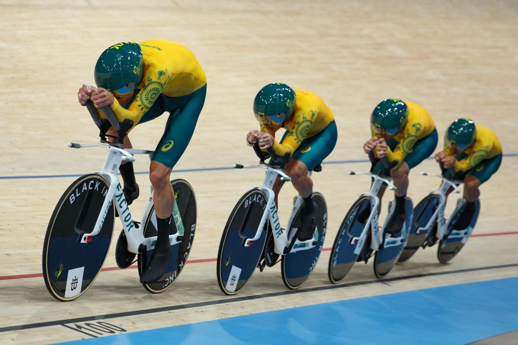 Australia's Oliver Bleddyn, Australia's Sam Welsford, Australia's Conor Leahy and Australia's Kelland O'brien compete to break the world recors during the men's track cycling team pursuit first round of the Paris 2024 Olympic Games at the Saint-Quentin-en-Yvelines National Velodrome in Montigny-le-Bretonneux, south-west of Paris, on August 6, 2024. (Photo by Thomas SAMSON / AFP)