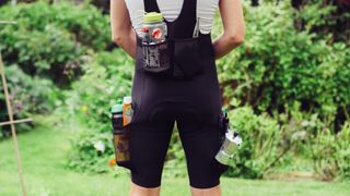 A pair of bib shorts with the pockets overflowing with items
