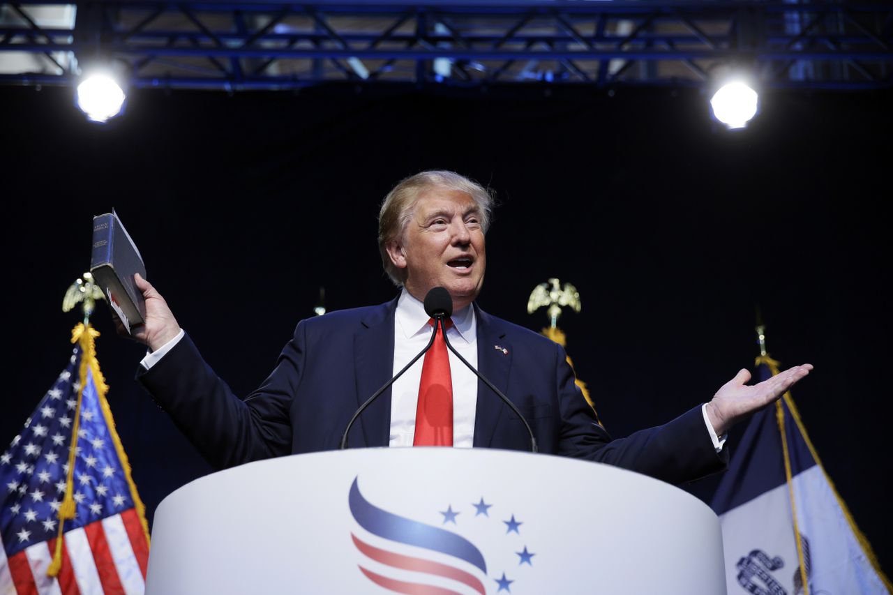 Republican presidential candidate, businessman Donald Trump holds a Bible as he speaks during the Iowa Faith &amp;amp; Freedom Coalition&amp;#039;s annual fall dinner, Saturday, Sept. 19, 2015, in Des Moines,