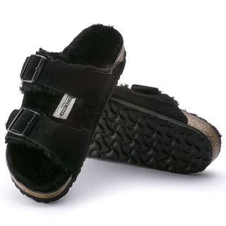 Image of a pair of black shearling lined arizona double strap Birkenstock sandals