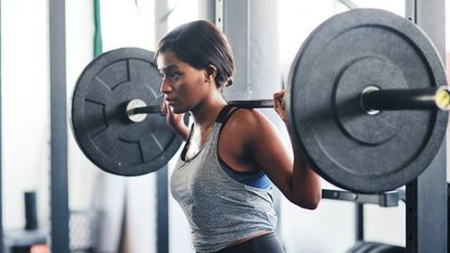 Woman doing squats to build muscle