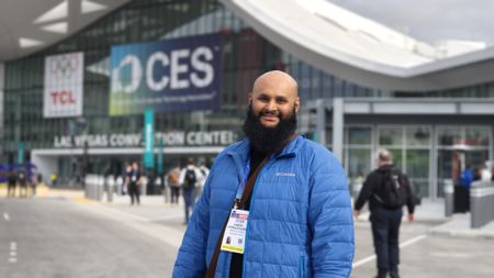 Harish standing in front of the Las Vegas convention center
