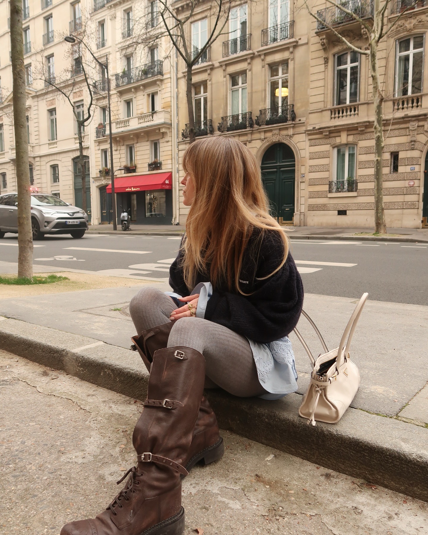 Fashion person Jeanette Madsen wears a coloured tights outfit. She wears grey cable knit tights.