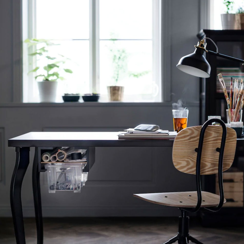 study room with desk and black lamp