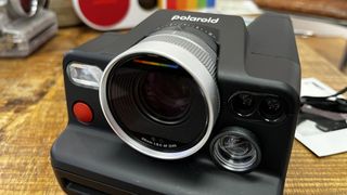 The Polaroid I-2 camera on a wooden table
