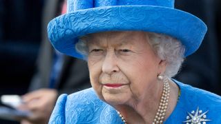 Queen Elizabeth II watches the runners in the parade ring for the Epsom Derby at Epsom Racecourse on June 1, 2019 in Epsom, England