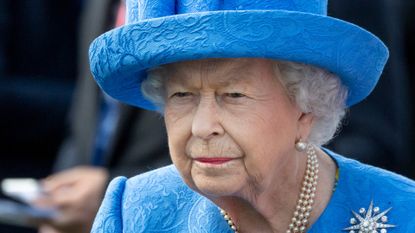 Queen Elizabeth II watches the runners in the parade ring for the Epsom Derby at Epsom Racecourse on June 1, 2019 in Epsom, England