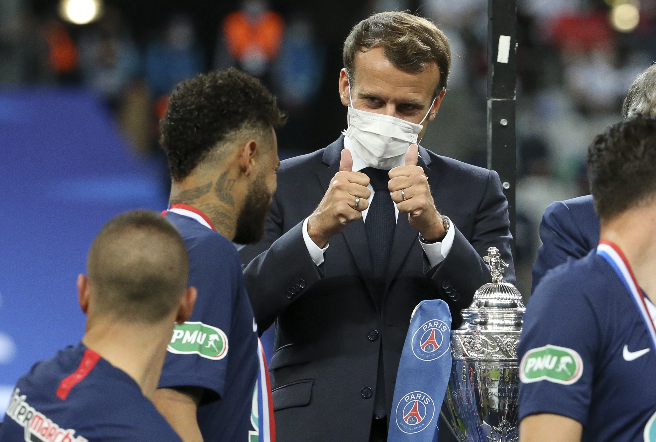 Neymar gets a thumbs-up from French president Emmanuel Macron, wearing a face mask due to Covid-19 restrictions, after Paris Saint-Germain's win over Saint-Etienne in the Coupe de France final in July 2020.